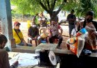 Bhabinkamtibmas-Bripka-Gergorius-Ojan-Monitoring-Giat-Penyaluran-PKH