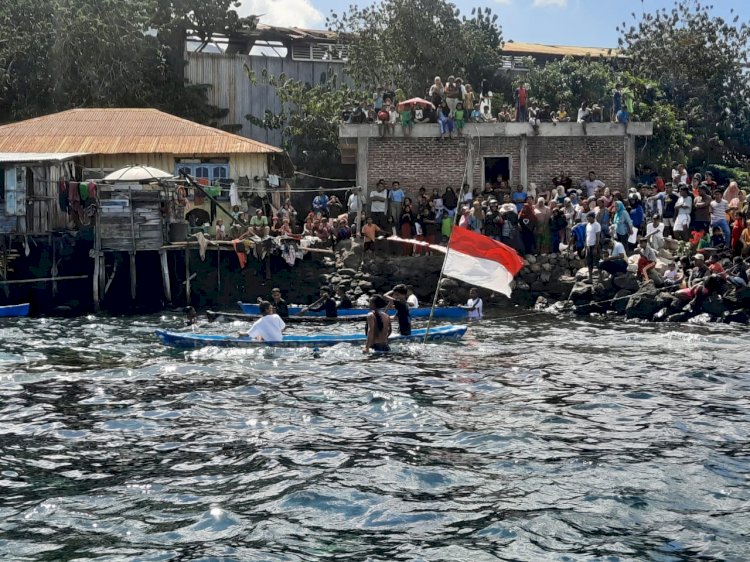 Bripka Ruslan M. Jafar Bhabinkamtibmas Ekasapta  Lakukan Pengamanan Lomba Renang dan Dayung Sampan.